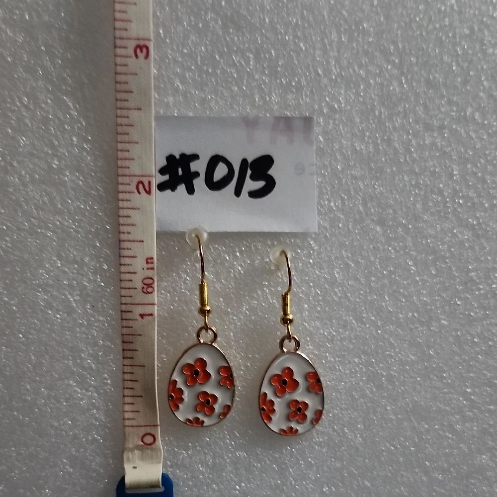 Hand Crafted White Enamel Drop Earrings with Orange Floral Motif